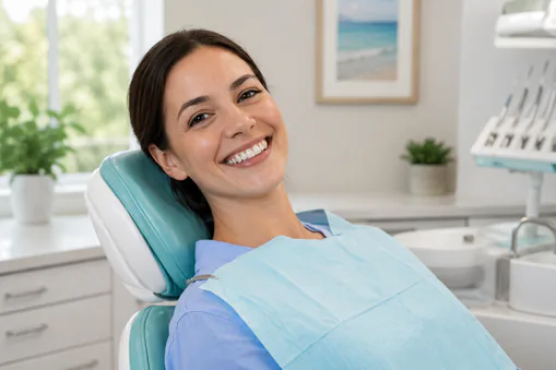 happy man in dentist chair smiling